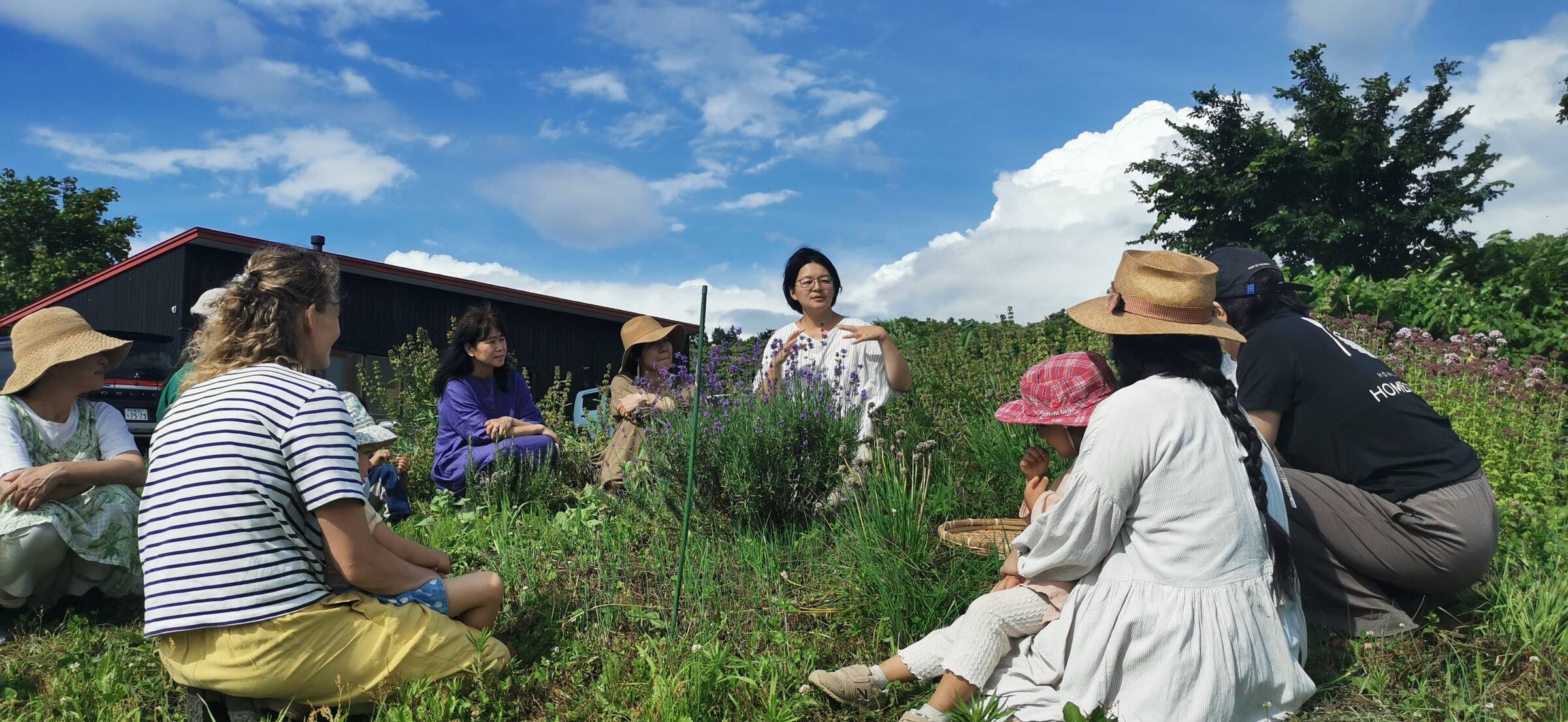 Guests sitting in the herb garden during the nature walk