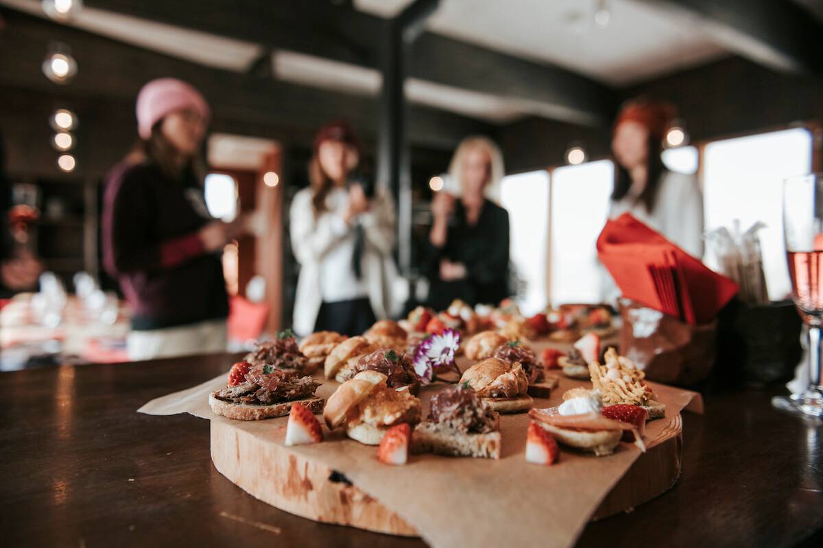 Guests gathered around a seasonal tasting platter