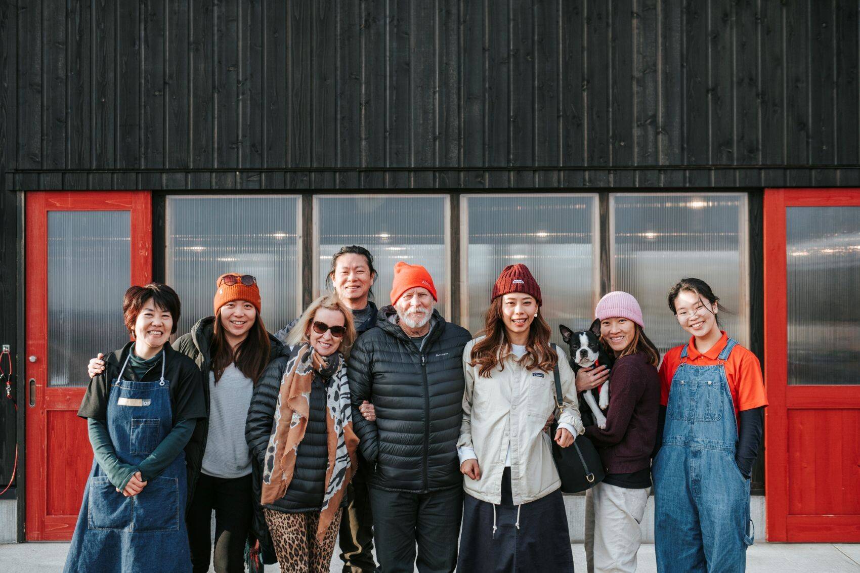 Smiling guests in front of the Barn Kitchen