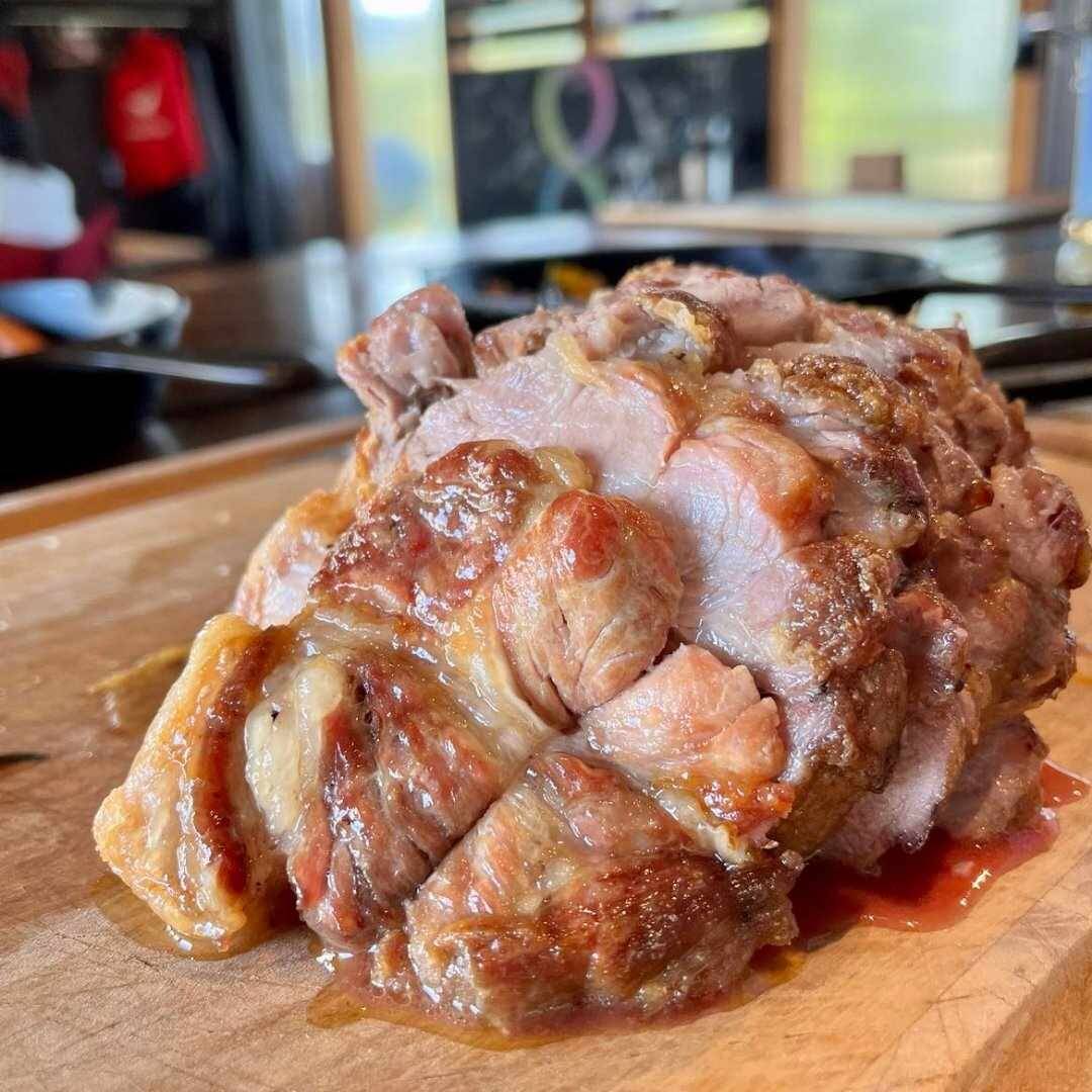 A slow-roasted pork joint on the carving board
